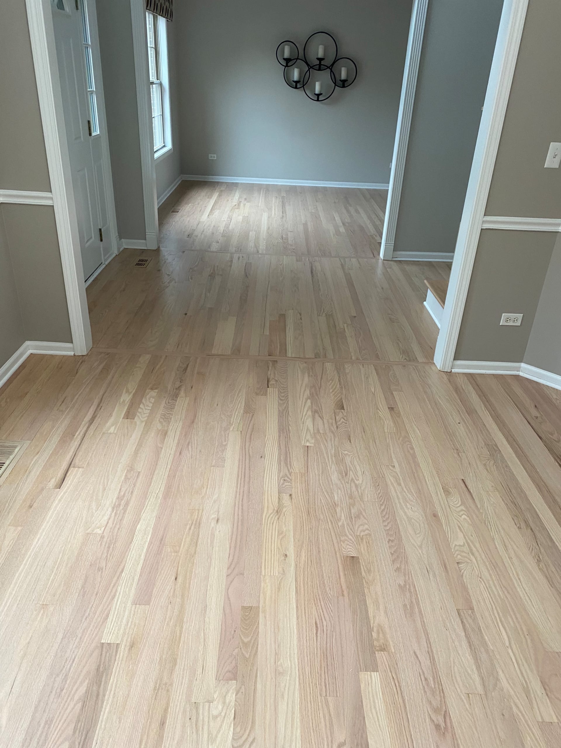 Finished hardwood floor showing stain color and natural wood character