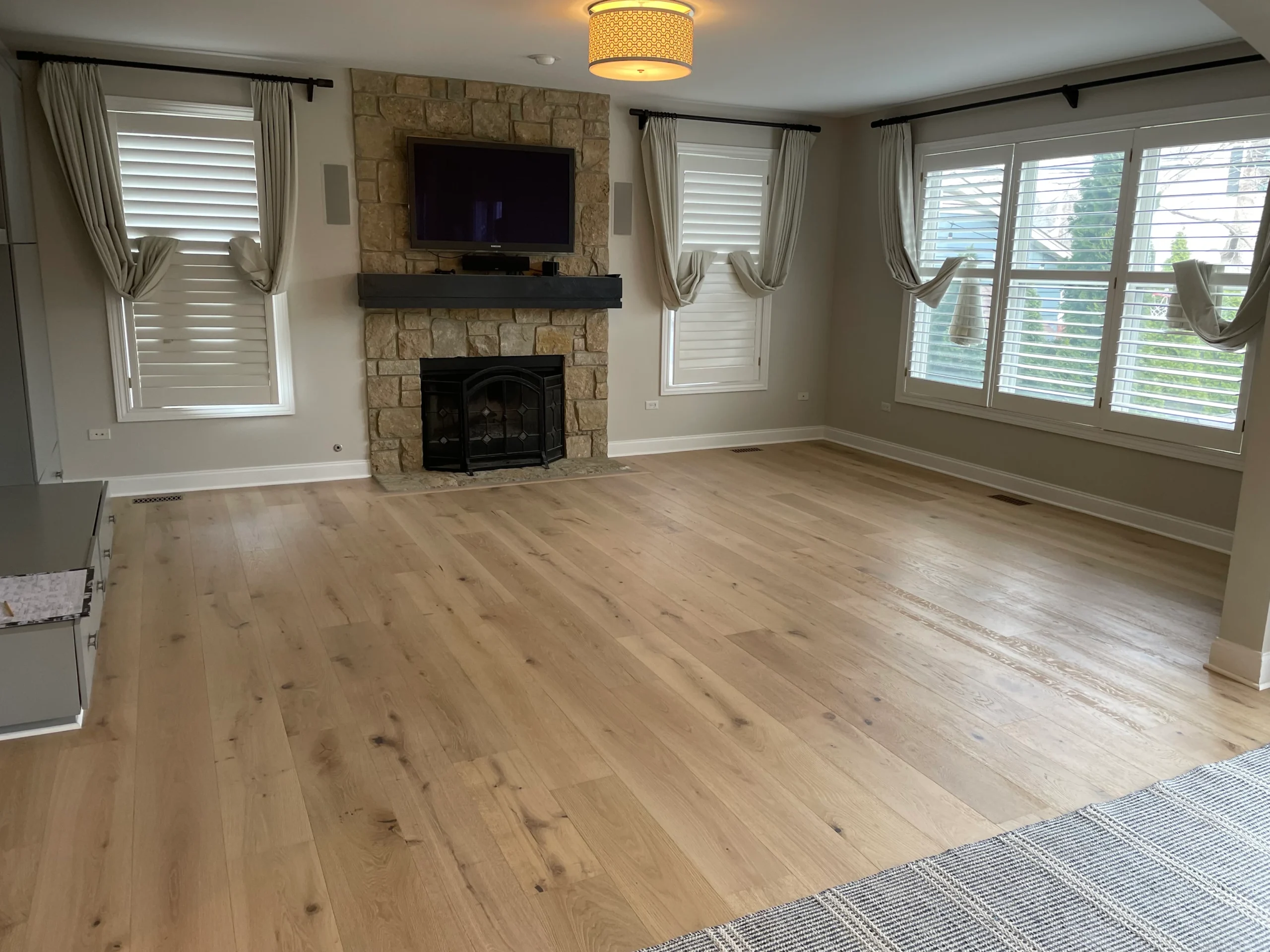 Buff and coat hardwood flooring project by Craftsman Hardwood Floors